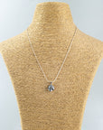 Fused glass pendant necklace, handmade in soft coastal hues, hung on a sterling silver chain. 