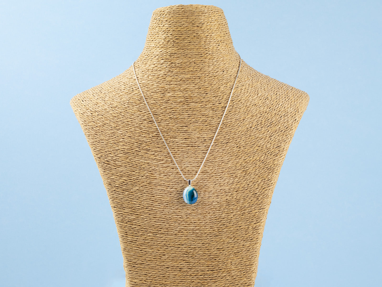 Fused glass pendant necklace, handmade in marine blues, hung on sterling silver chain. 