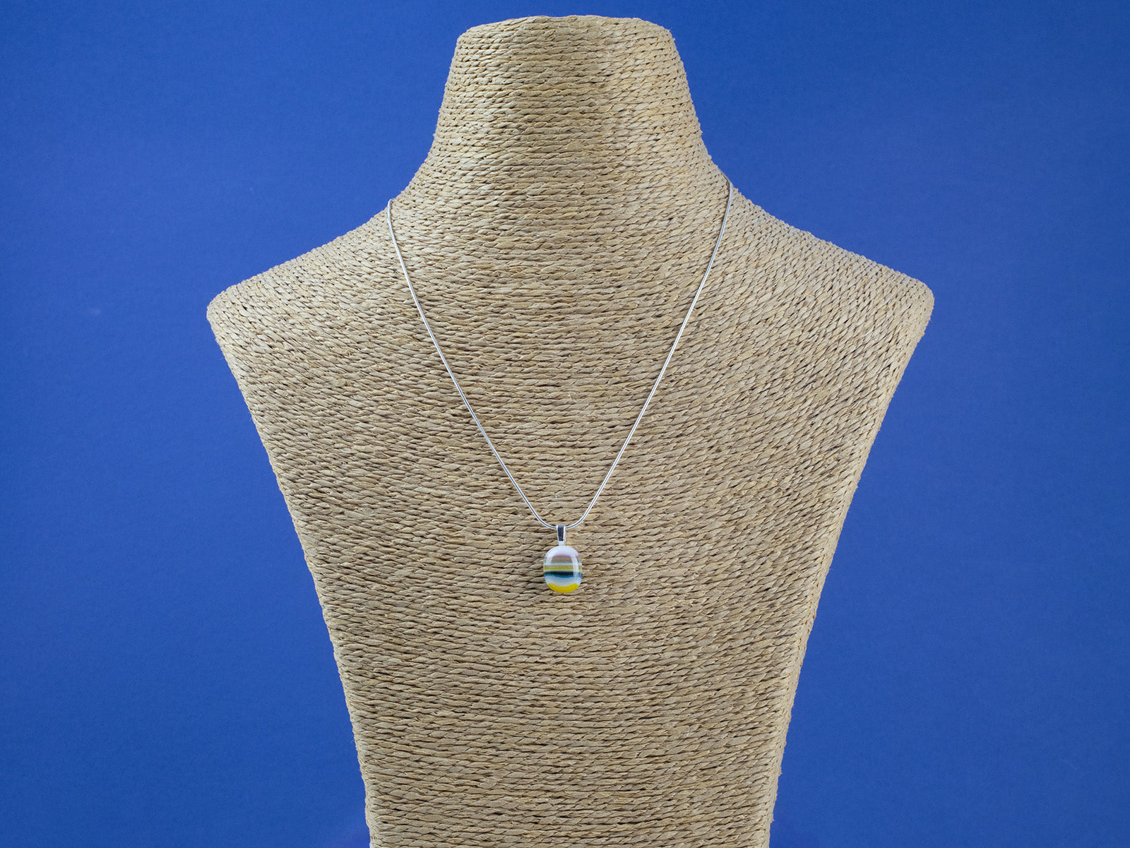 Fused glass pendant necklace, handmade in soft coastal colours, hung on sterling silver chain. 