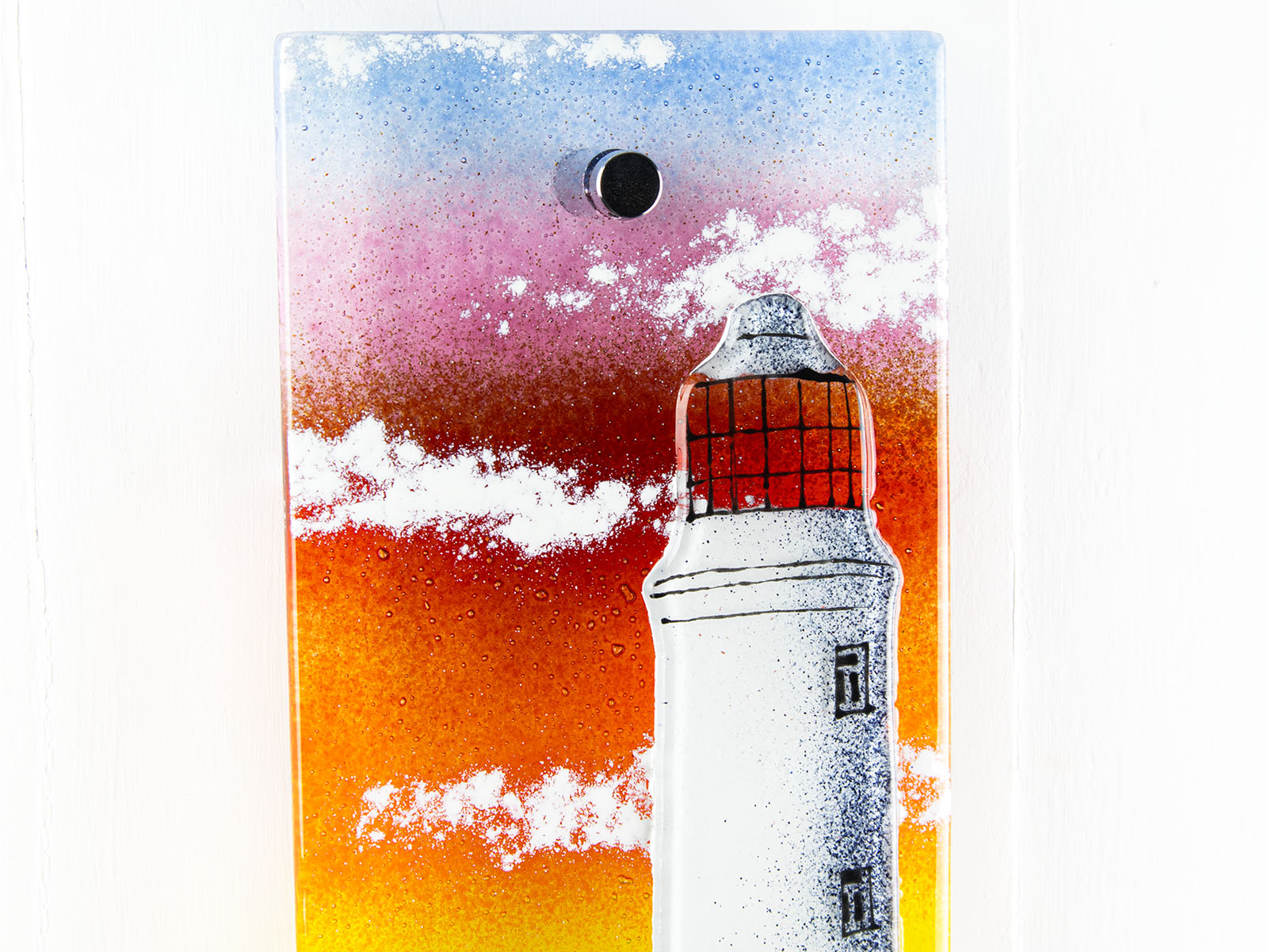 Handmade wall panel featuring a lighthouse with bright sunset colours. Gorgeous Artisan wall art piece, designed in Cornwall. 