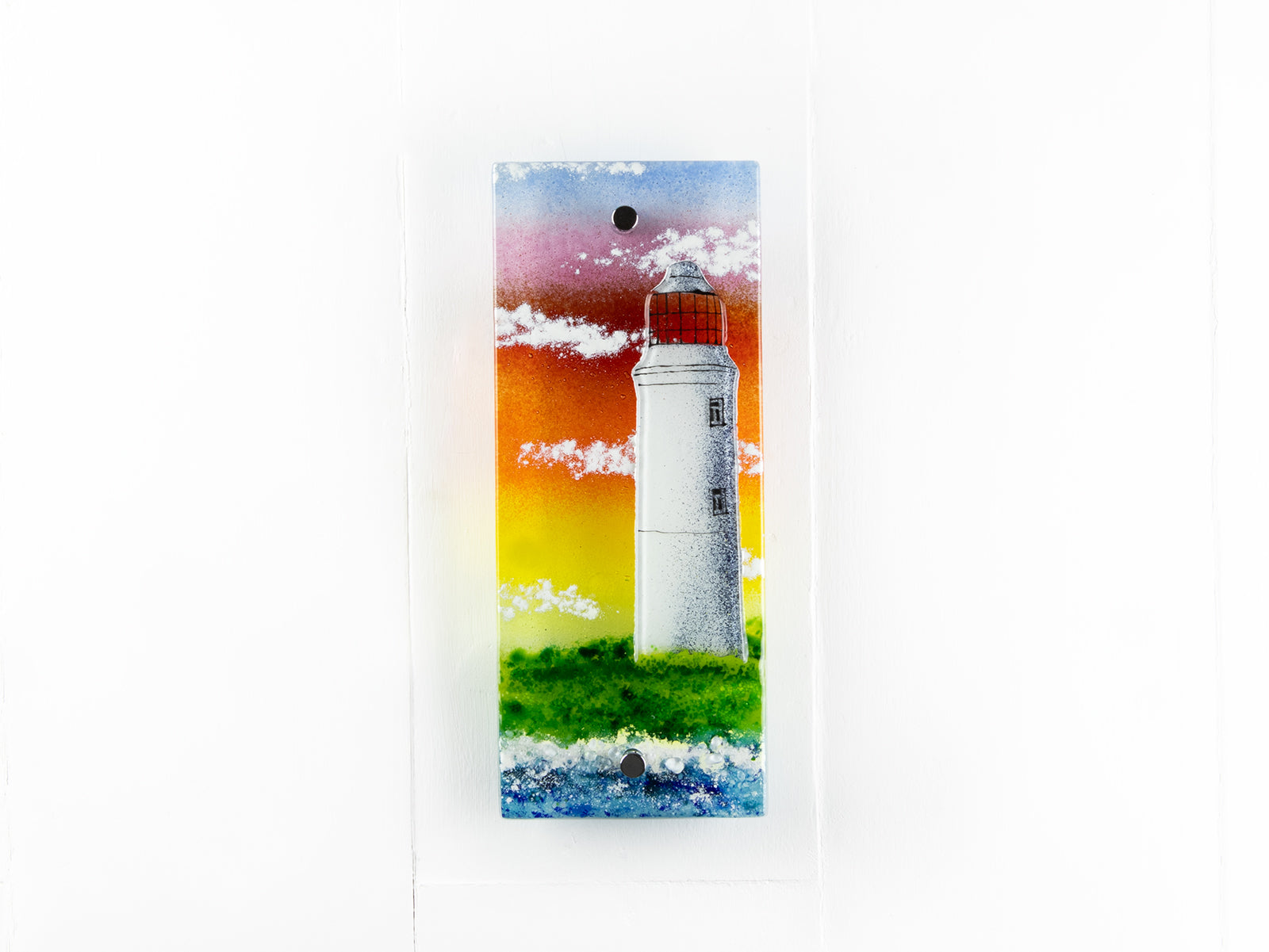 Handmade wall panel featuring a lighthouse with bright sunset colours. Gorgeous Artisan wall art piece, designed in Cornwall. 