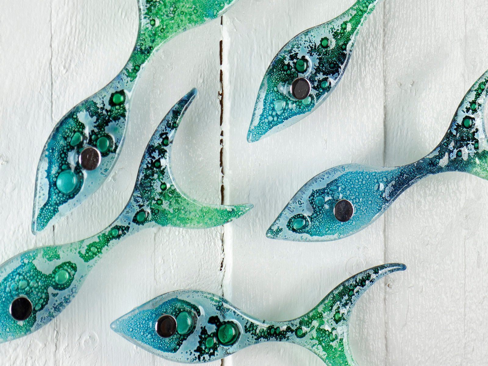 detail of gwithian mini shoal featuring fused glass fish in blues and greens