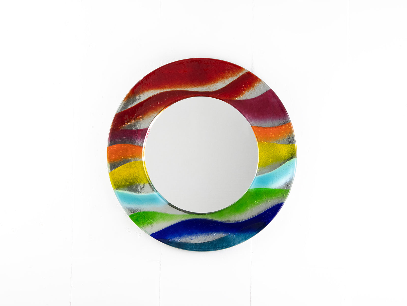 Round mirror with colorful wavy pattern on a white background