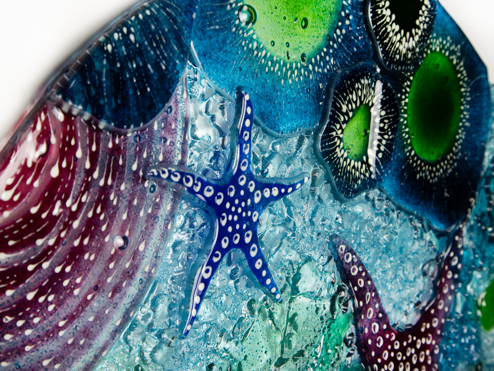 Close up of blue starfish on a fused glass extra large art frame, ocean reef inspired with coastal colours and texture.