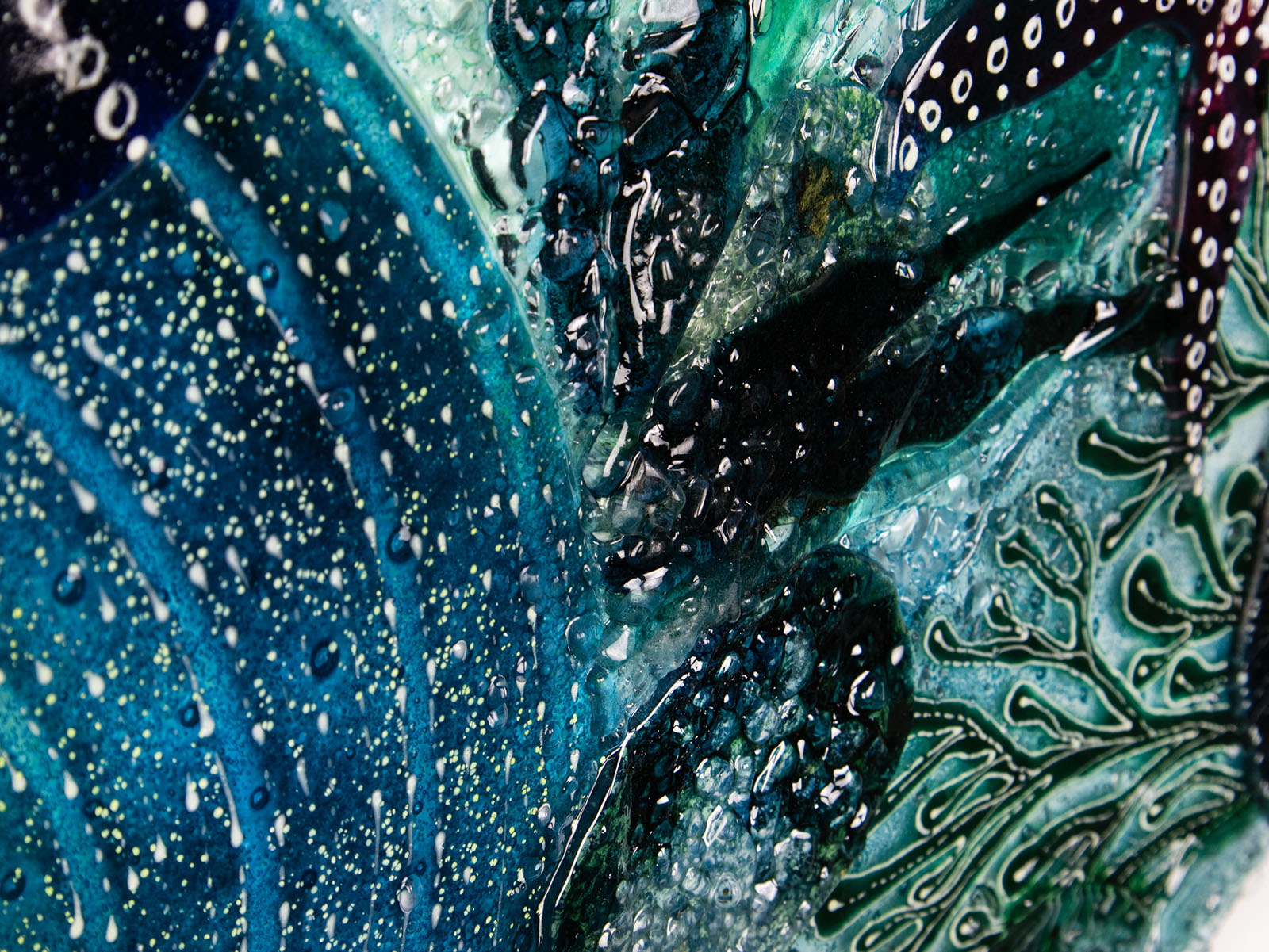Super close up of the textural detail  on a fused glass extra large art frame, ocean reef inspired with coastal colours.