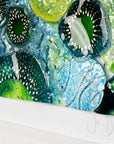 Close up of intricate ocean reef inspired fused glass art frame. Bright ocean blue colours and handmade wall art. 