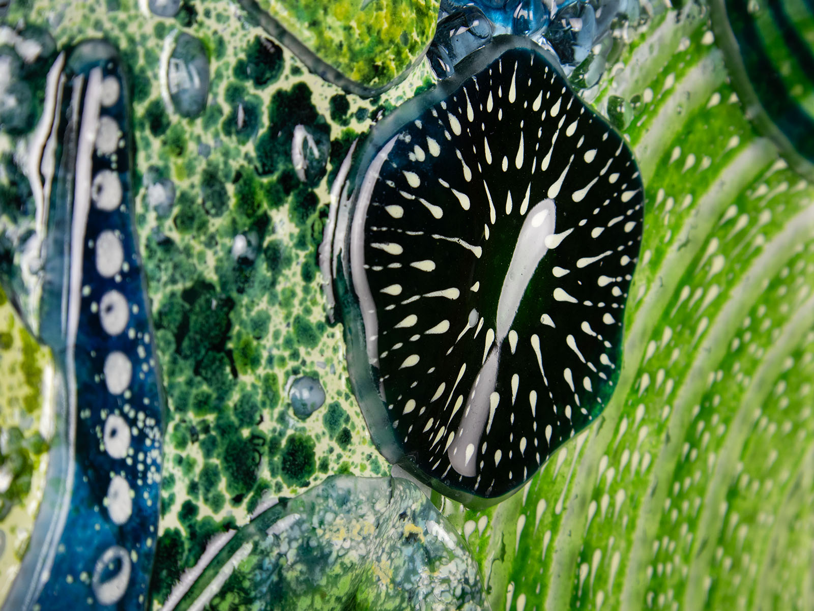 Close up of intricate ocean reef inspired fused glass art frame. Bright ocean blue colours and handmade wall art. 