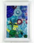 Intricate ocean reef inspired fused glass art frame. A vibrant and handmade piece of wall art. 