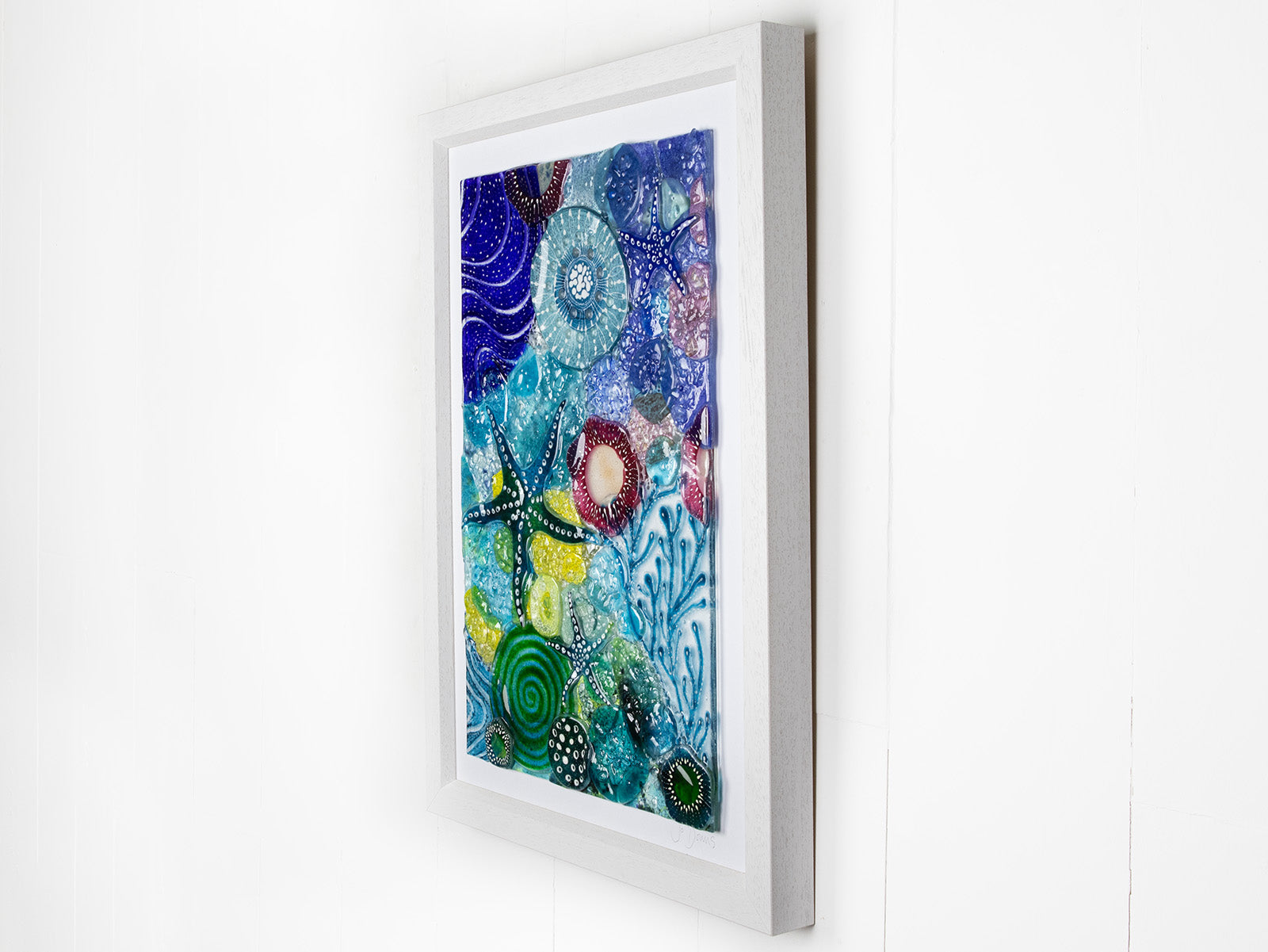 Intricate ocean reef inspired fused glass art frame. A vibrant and handmade piece of wall art. 