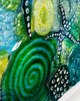 Close up of intricate ocean reef inspired fused glass art frame. A vibrant and handmade piece of wall art. 