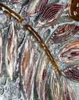 Leaf detailing of fused glass round wall panel, made from fused glass, inspired by the autumnal country-side. Striking, handmade wall art with organic texture. 