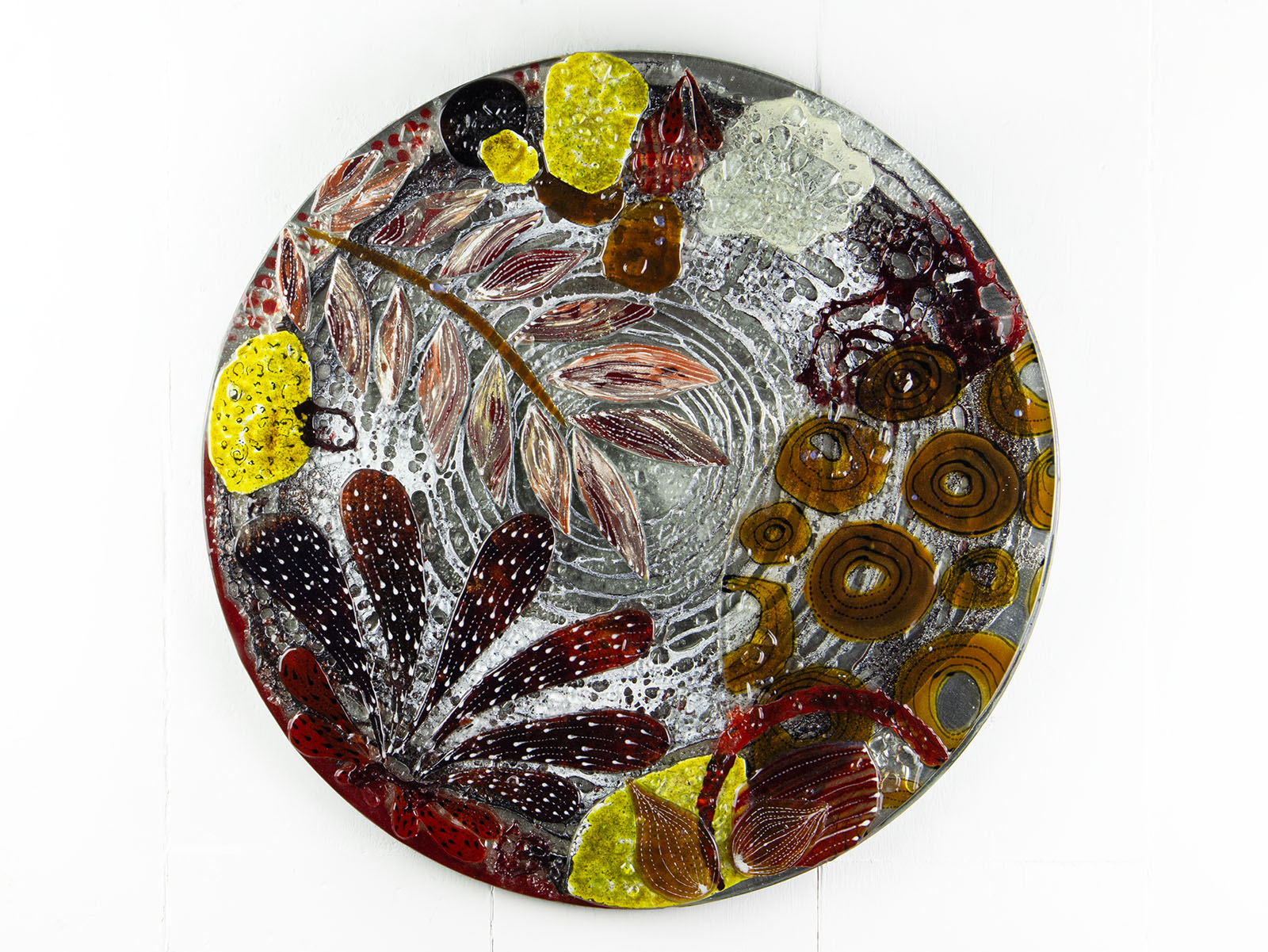 Fused glass round wall panel, made from fused glass, inspired by the autumnal country-side. Striking, handmade wall art with organic texture. 