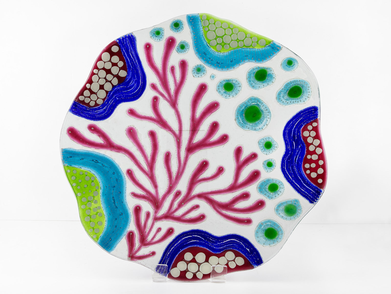 Fused glass round dish, with hand painted design inspired by the ocean reefs in bright colours. 
