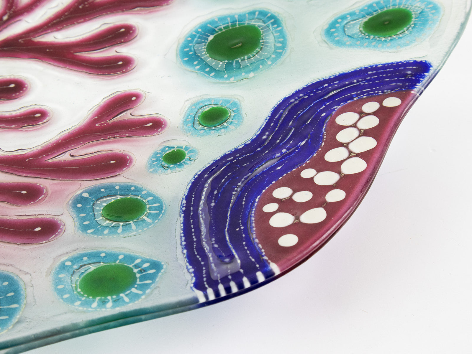 Fused glass round dish, with hand painted design inspired by the ocean reefs in bright colours. 