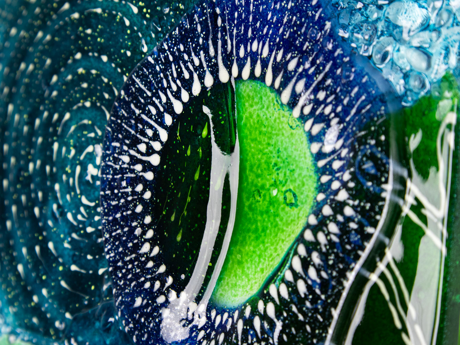 Close up in fused glass art frame, inspired by the ocean with lots of texture and bright coastal colours. A unique piece of wall art, handmade in Cornwall, Launceston. 