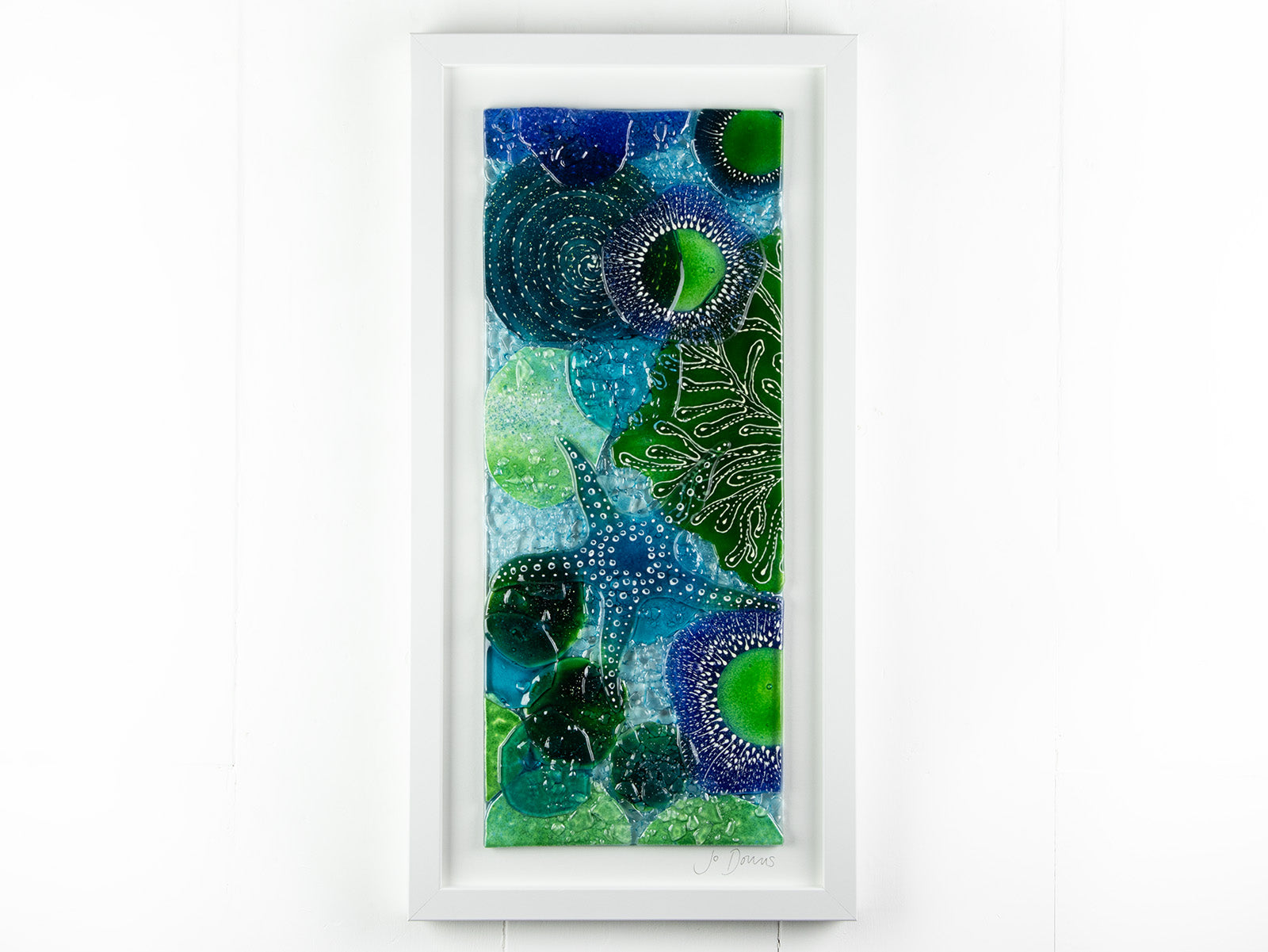 Fused glass art frame, inspired by the ocean with lots of texture and bright coastal colours. A unique piece of wall art, handmade in Cornwall, Launceston. 