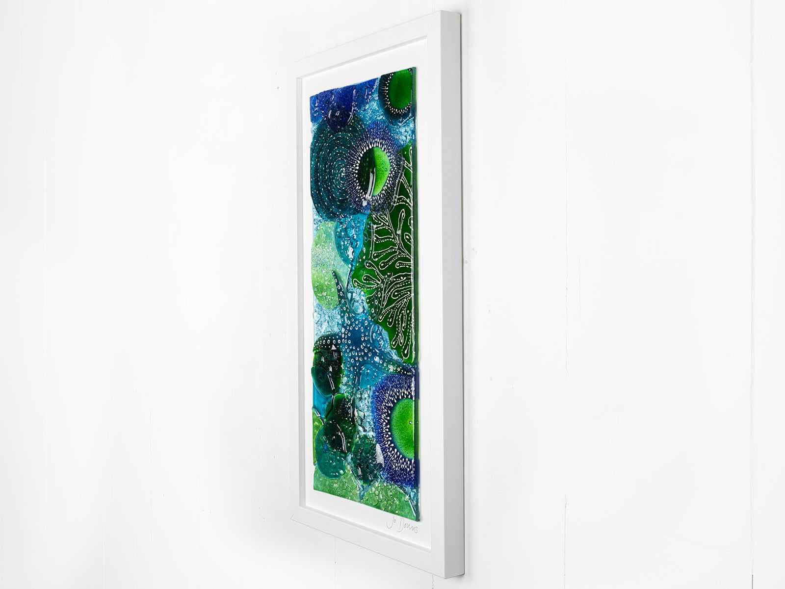 Fused glass art frame, inspired by the ocean with lots of texture and bright coastal colours. A unique piece of wall art, handmade in Cornwall, Launceston. 