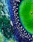 Close up of fused glass art frame, inspired by the ocean with lots of texture and bright coastal colours. A unique piece of wall art, handmade in Cornwall, Launceston. 
