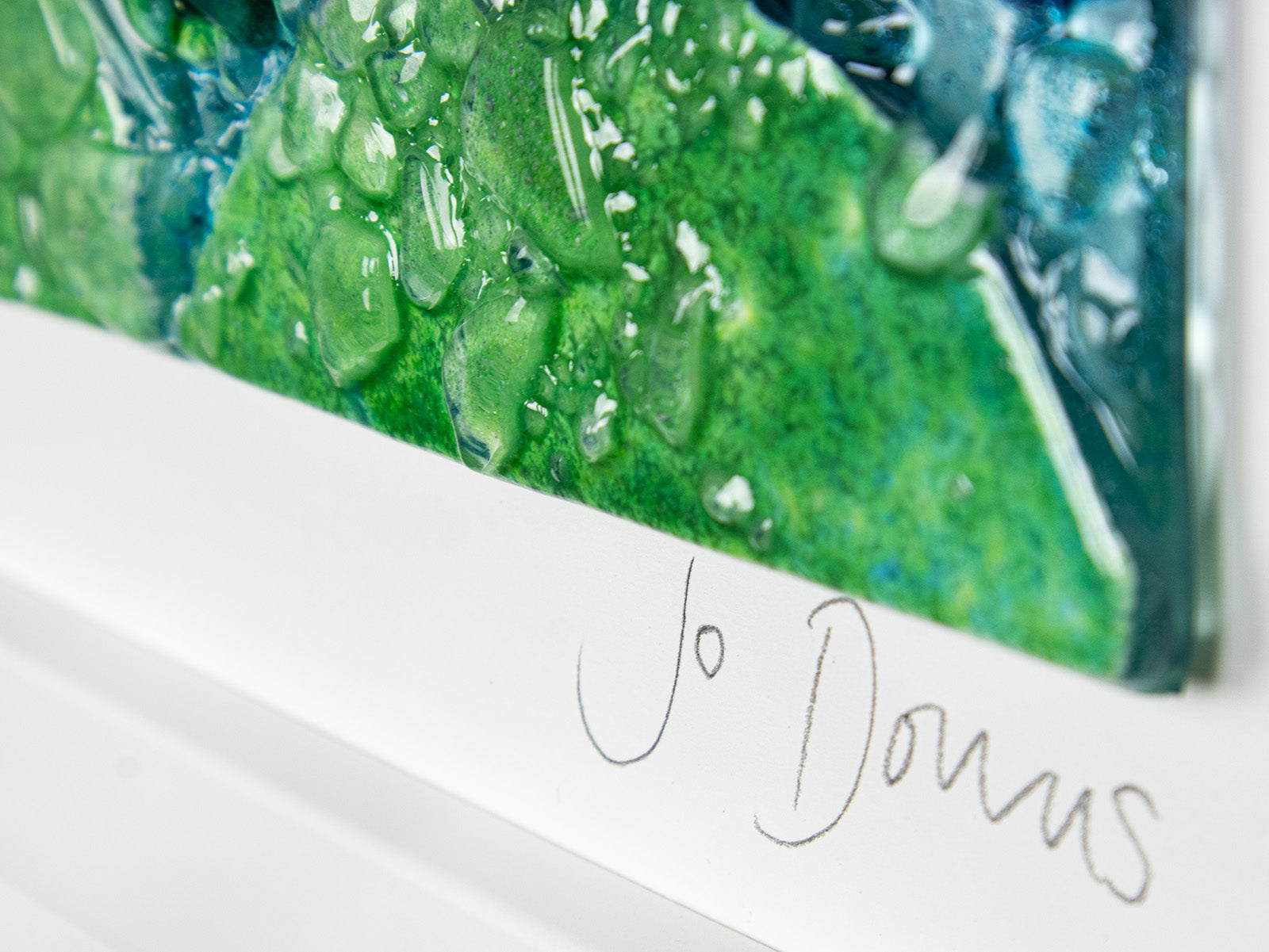 Signature on fused glass art frame, inspired by the ocean with lots of texture and bright coastal colours. A unique piece of wall art, handmade in Cornwall, Launceston. 