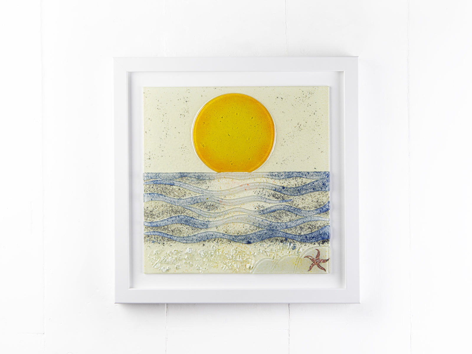 Fused glass large art frame, inspired by the sunrise along the Cornish coast. Handmade in our Launceston studio, with textural detailing. 