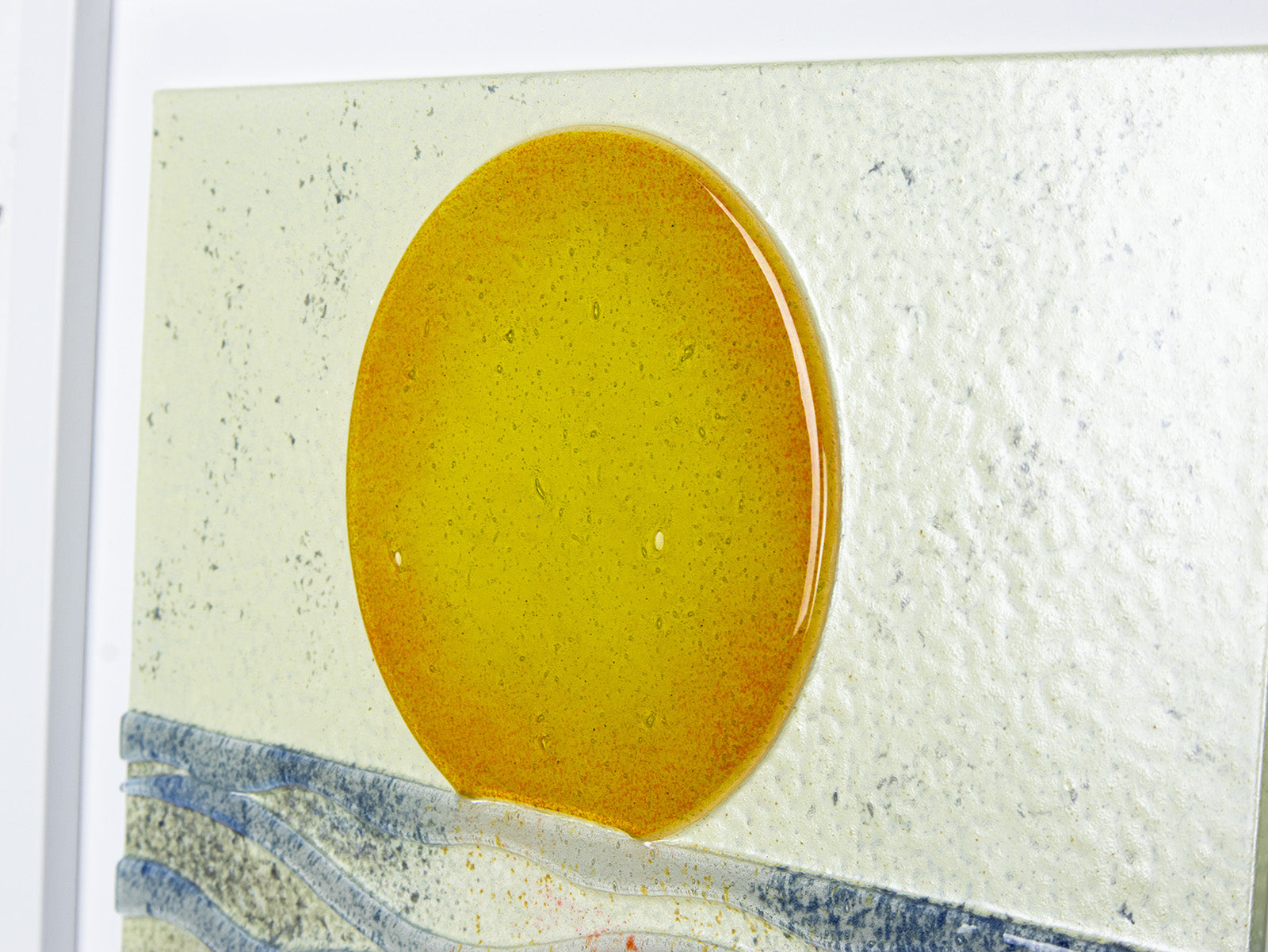 Fused glass large art frame inspired by a sunrise on the coast. Handmade wall art with textural detailing. 