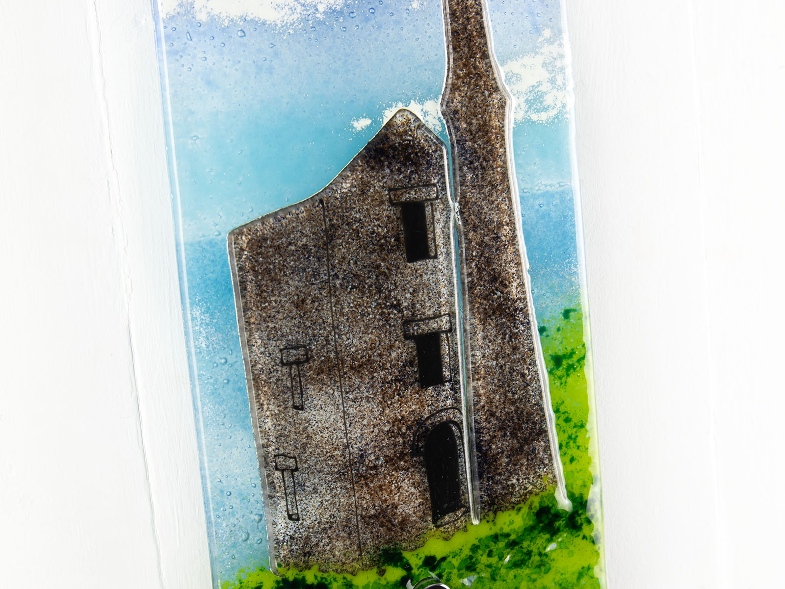 Details of a tin mine on a fused glass wall panel with hand-painted design and coastal colours.