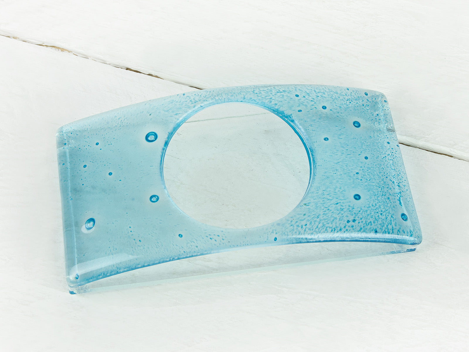 A blue glass soap dish with a subtle aqua color-way and bubble texture, handmade.