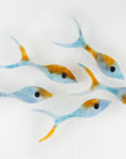 Small display of fused glass fish, individually handmade in sunset orange and sea blue colours. 