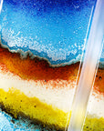 Three fused glass panels, forming a handmade triptych wall art piece, designed in coastal bright colours.