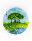 Fused glass round panel, inspired by the Nearly Home Trees in Devon, designed in bright summer greens. 