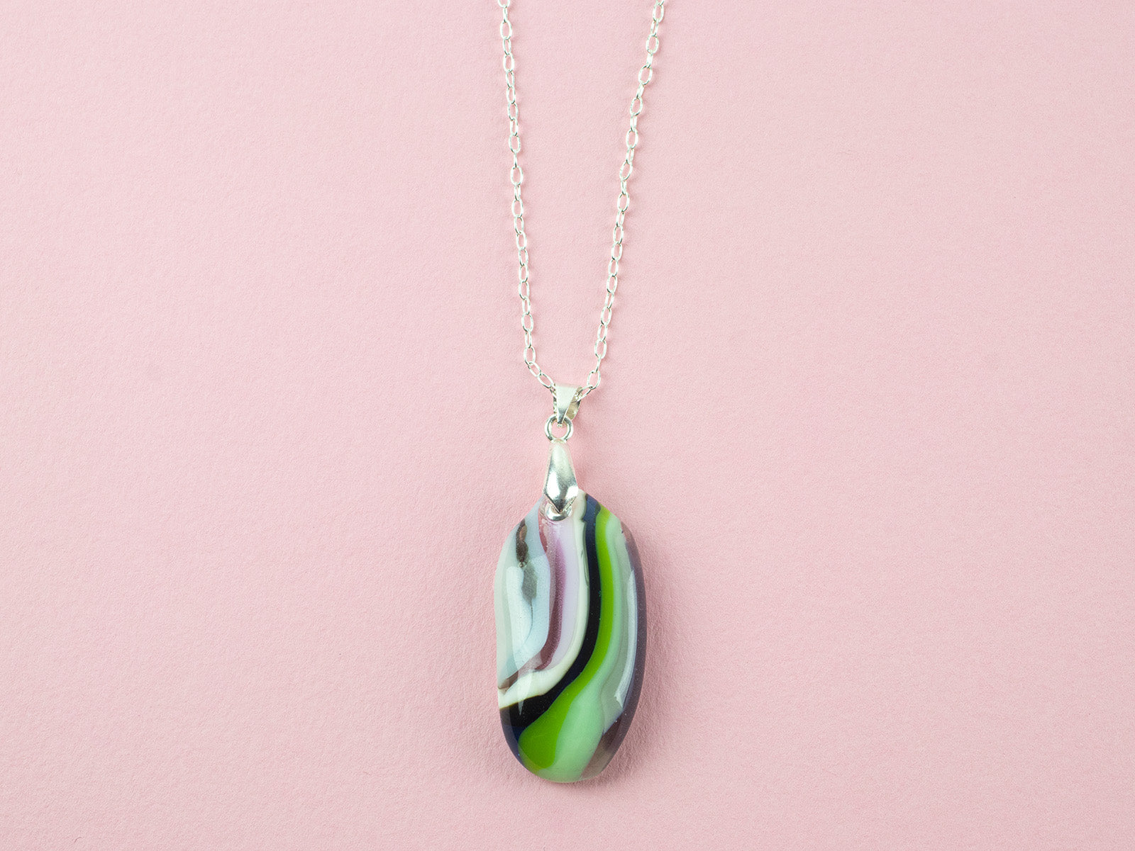 Fused glass pendant necklace in soft green and pink hues Handmade in organic colours and presented on a sterling silver chain. 
