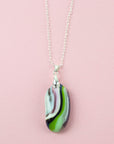 Fused glass pendant necklace in soft green and pink hues Handmade in organic colours and presented on a sterling silver chain. 