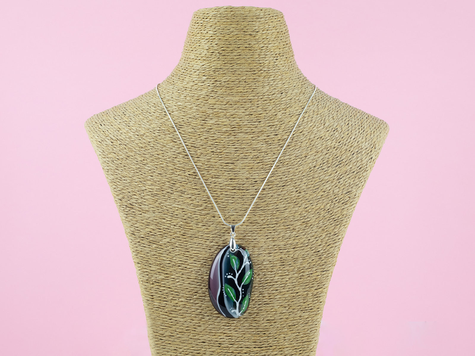 Fused glass pendant necklace, handmade in spring greens and pinks, with botanical hand-painted design.  Hung on a sterling silver chain. 