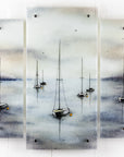 Fused glass staggered triptych featuring a hand-painted sailboat design in a soft and misty colour-way. 