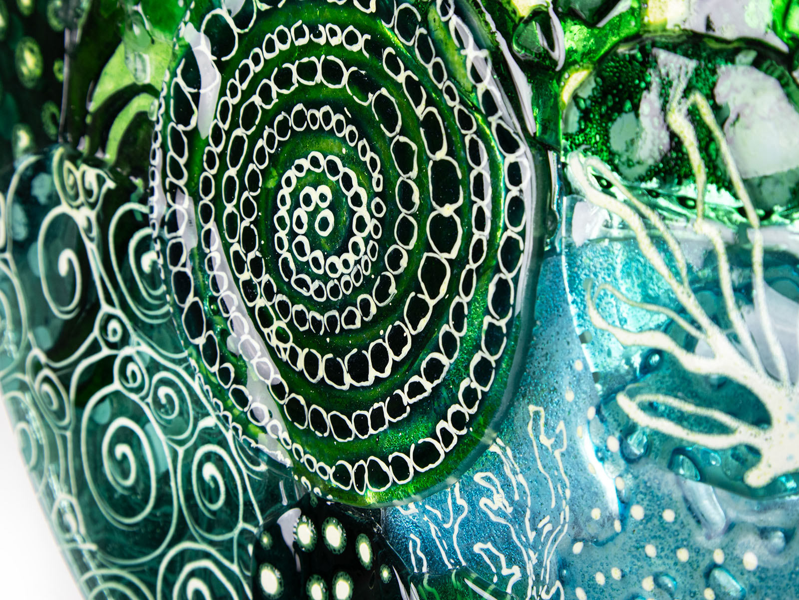 Details of a fused glass wall panel, with organic hand-painted designs and ocean colours.