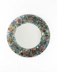 A fused glass round mirror handmade using multi coloured recycled glass, creating a striking piece of wall art. 