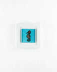 A fused glass art frame with a copper seahorse design on an aqua blue color-way, handmade.